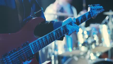 guitar player on stage at a concert rocking the audience