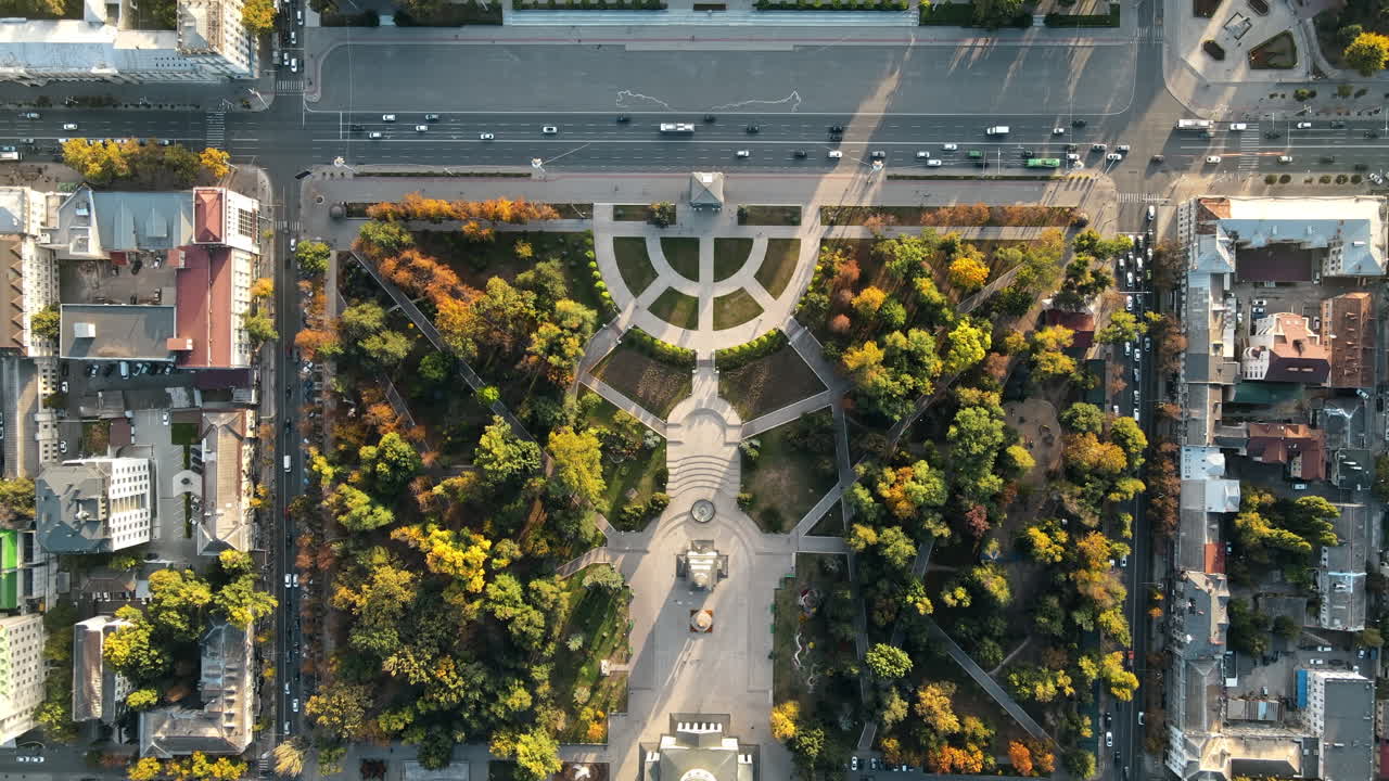 Aerial drone view of Chisinau downtown at sunset. Vertical view of central park, Cathedral, bell tower, Triumphal Arch, Govermental building. Moldova. Vertical view