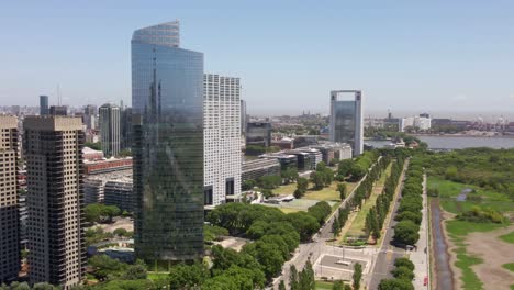 Aerial-parallax-shot-of-Puerto-Madero-waterfront-and-La-Plata-river-on-background