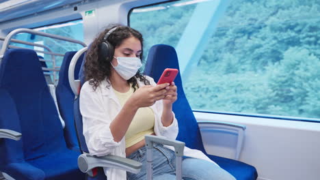 woman using phone on a train during travel