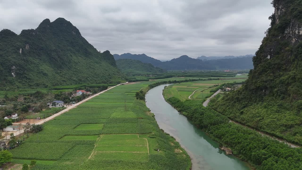 Aerial Drone Shot of River Passing Through The Village In Vietnam