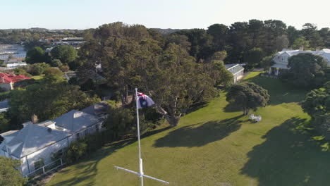 australian flag aerial orbit by the ocean