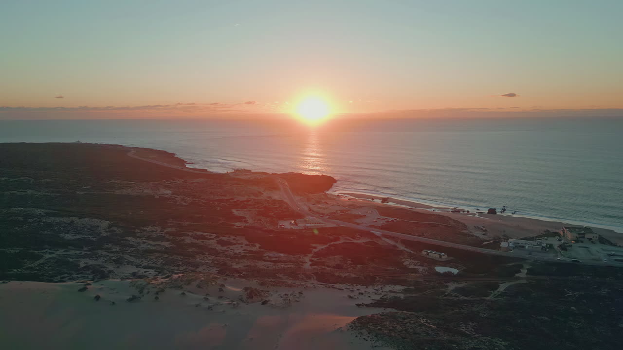 Aerial sunset ocean glow in serene evening. Twilight descend tranquil coastline