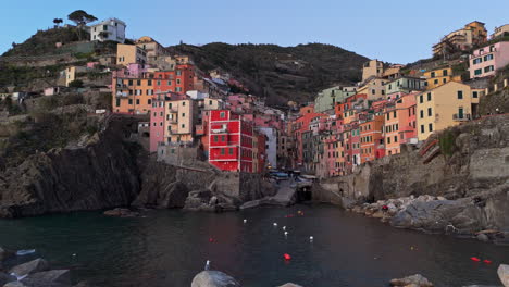 colorful buildings on the coast of riomaggiore, cinque terre, italy, near the sea