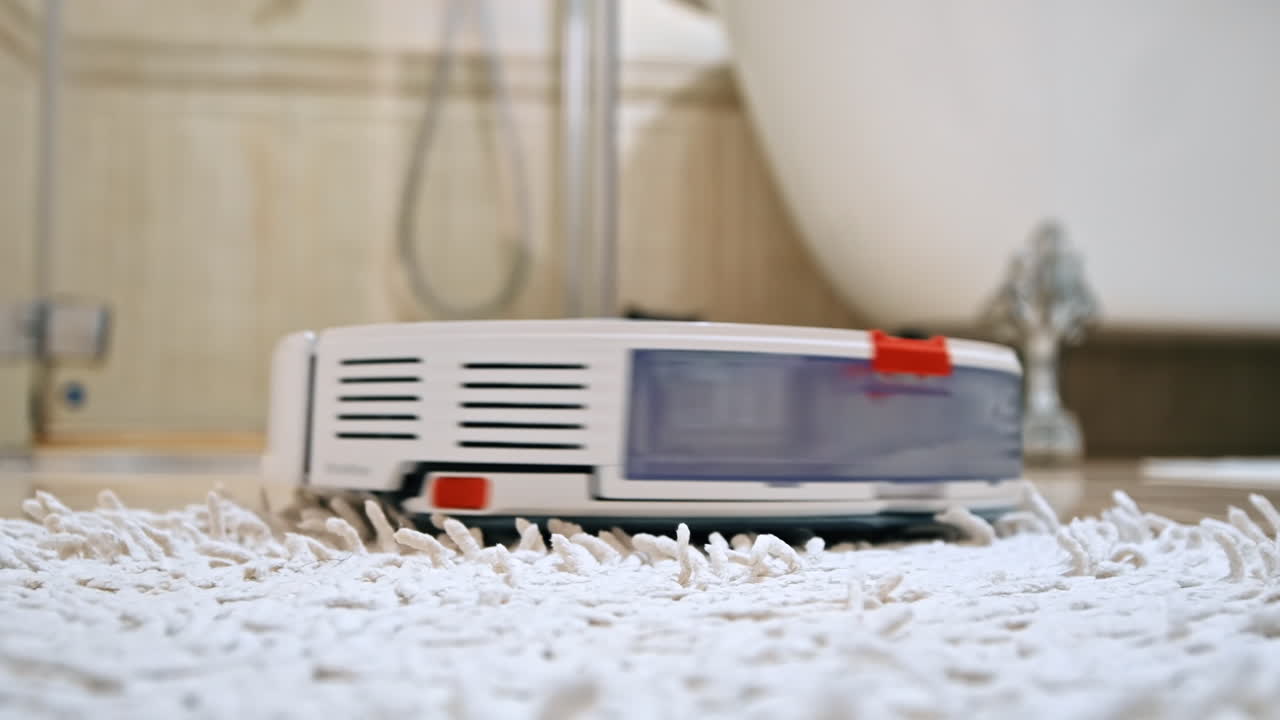 Working robotic vacuum cleaner at home, gets tangled in the carpet