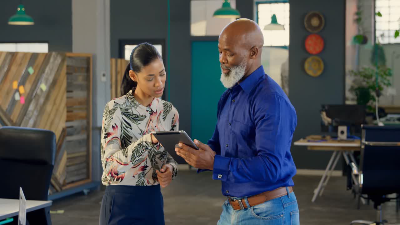 Business executives discussing over digital tablet 4k