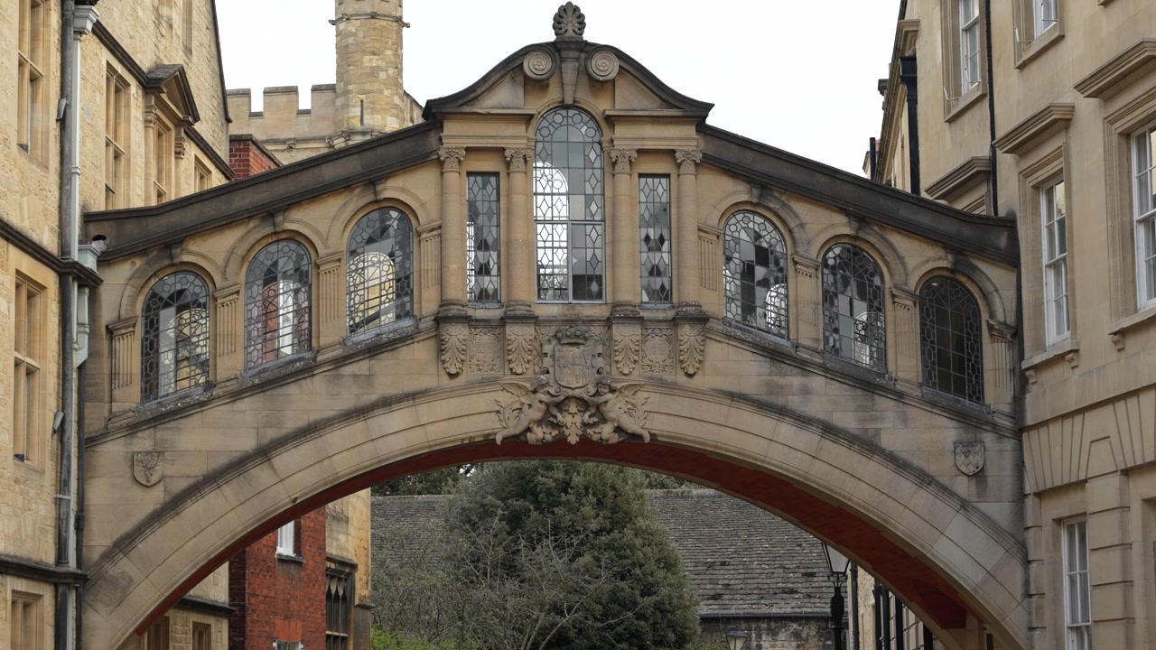 Historic stone bridge connecting buildings in Oxford city centre