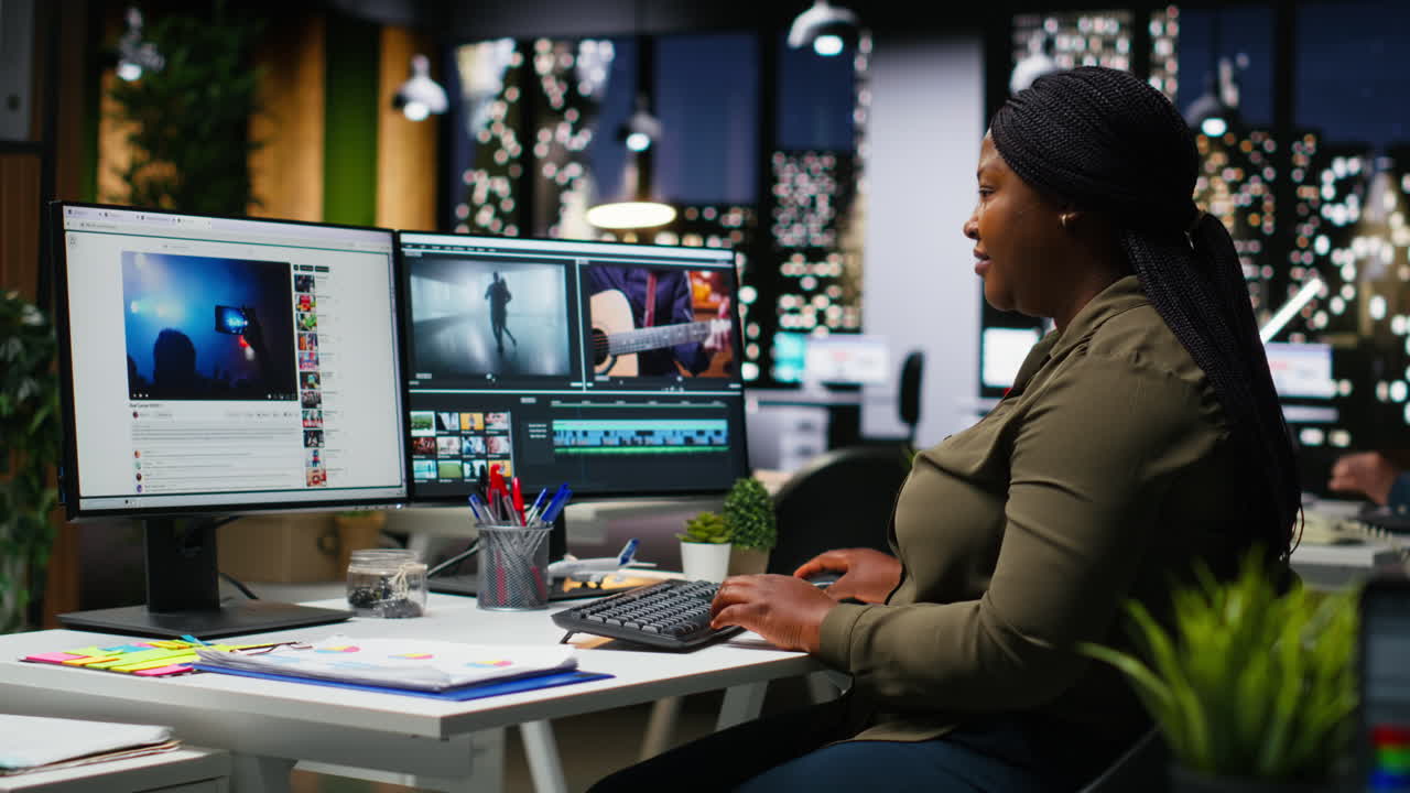 African american female videographer editing a film montage project