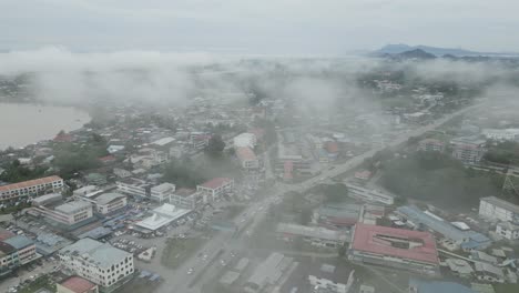 foggy morning beautiful drone view of sri aman town at batang lupar river, during regatta and pesta benak,sarawak, borneo.