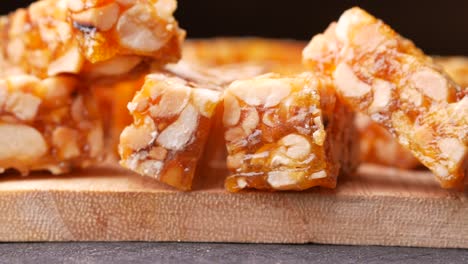 peanut brittle on wooden board