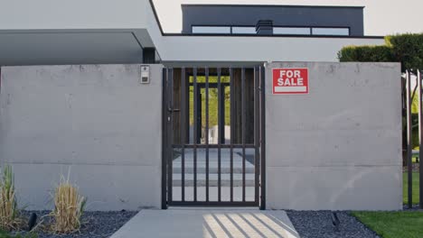 modern house for sale with concrete wall and metal gate