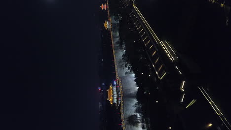 Vertical-format-night-aerial-to-illuminated-crenels-on-Xi'an-city-wall