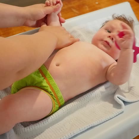 mom makes the baby massage