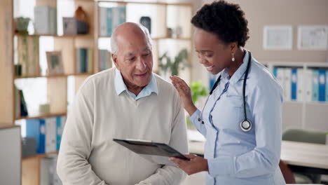 doctor consulting with elderly patient