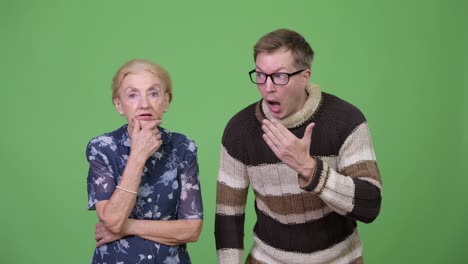 grandmother and grandson looking shocked together