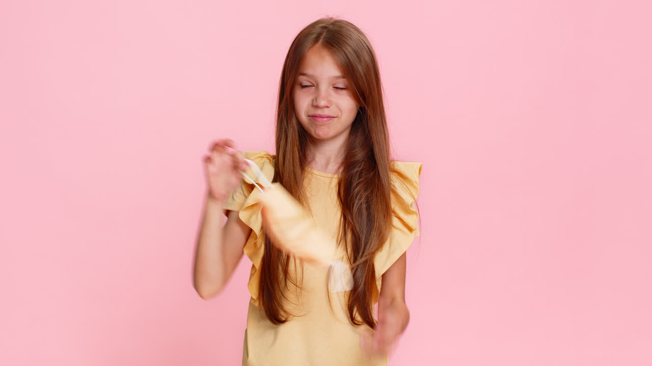 Child girl kid wearing protective mask showing stop hand sign then smiling with relief after removal