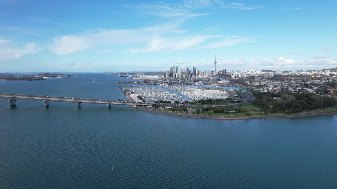 Aerial view of Auckland cityscape, harbor, and marina