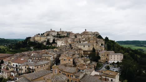 drone shot of ancient buildings in tuscany, italy