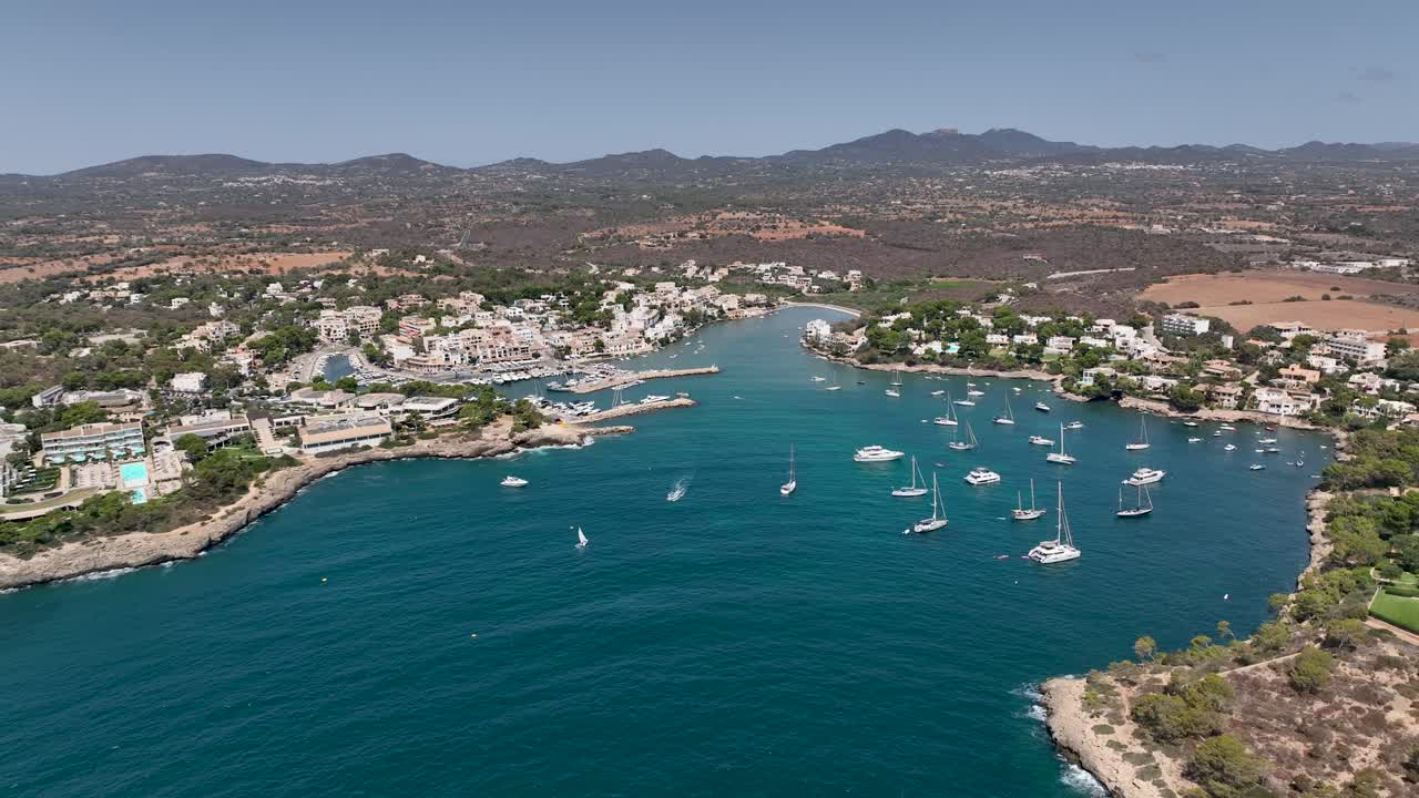 Aerial View of a Calm Coastal Town with Boats in a Bay