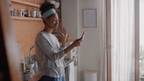 happy woman having video chat using smartphone at home chatting to friend enjoying conversation sharing lifestyle on mobile phone