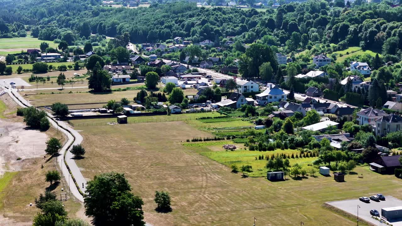 Small township of Zapyskis on Sunny day in Lithuania, aerial view