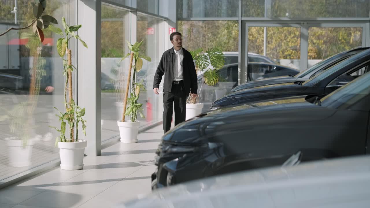 A man in a car dealership