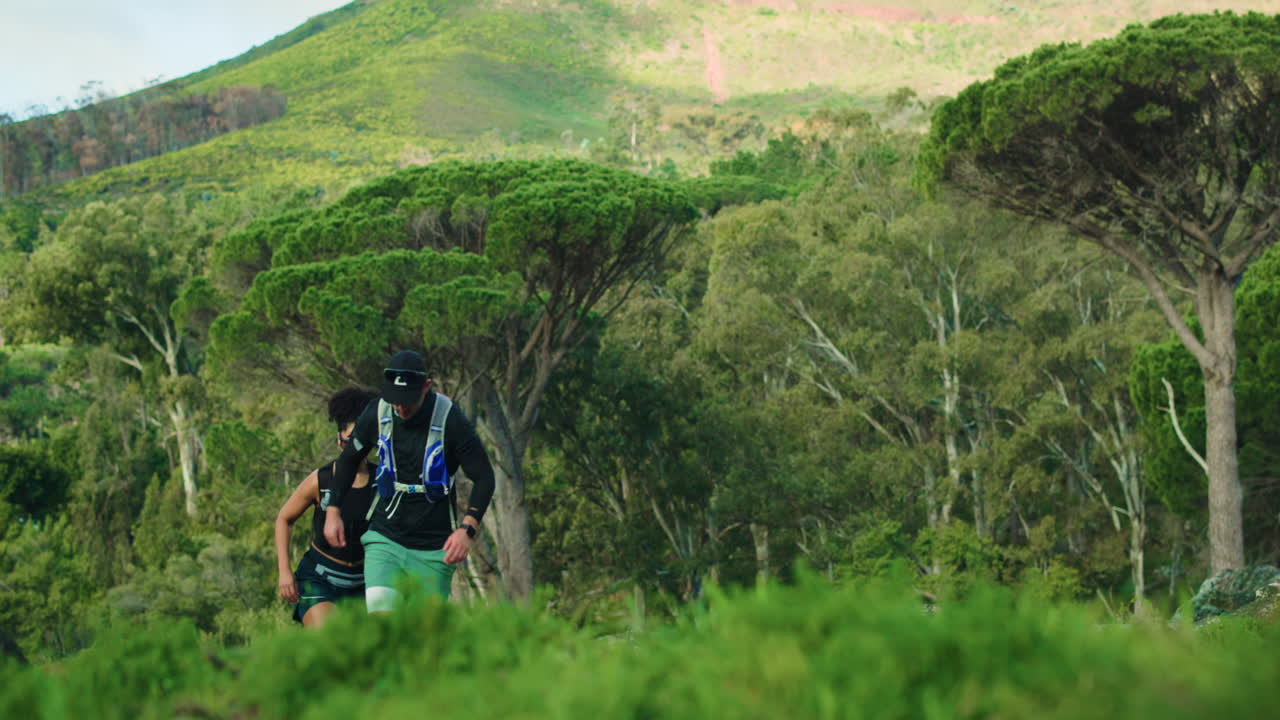 Couple trail running in nature