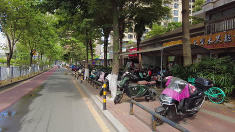 city street scene with shops and parking