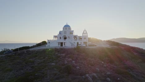 aerial - prophet elias orthodox church in keratea, greece at sunrise