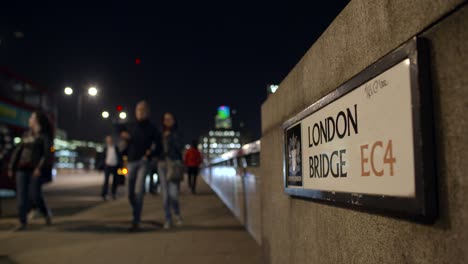 sign for london bridge at night