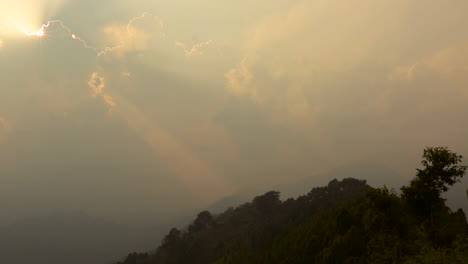 a heavenly sky with the sun shining through