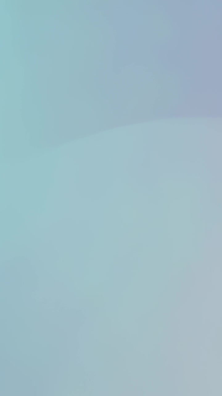 Vertical video: Shifting teal gradient changing across frame over time, providing calm mood