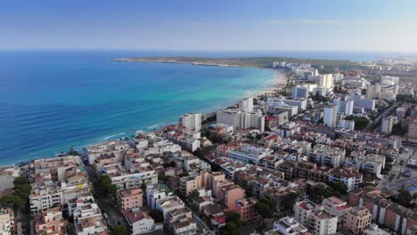 aerial views of buildings beside beach in majorca located by balearic sea