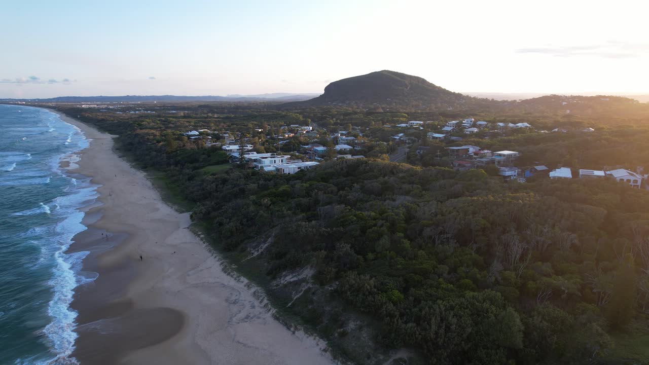 Golden Hour Aerial Of Yaroomba Coastline With Mount Coolum In Distance. Queensland, Australia