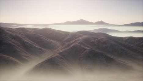 mountain landscape with deep fog at morning