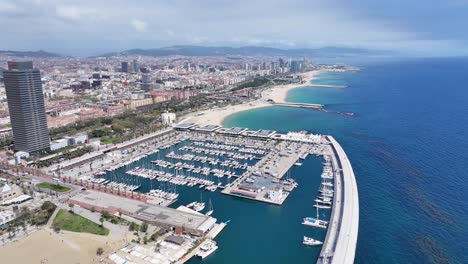 port of barcelona at barcelona in catalonia spain. urban beach. bay water scenery. downtown city. port of barcelona at barcelona in catalonia spain. peaceful landscape.