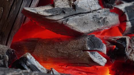 close up of glowing embers in a fire