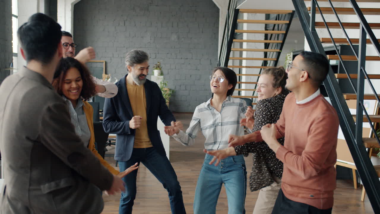 Happy and Energetic Office Team Celebrating