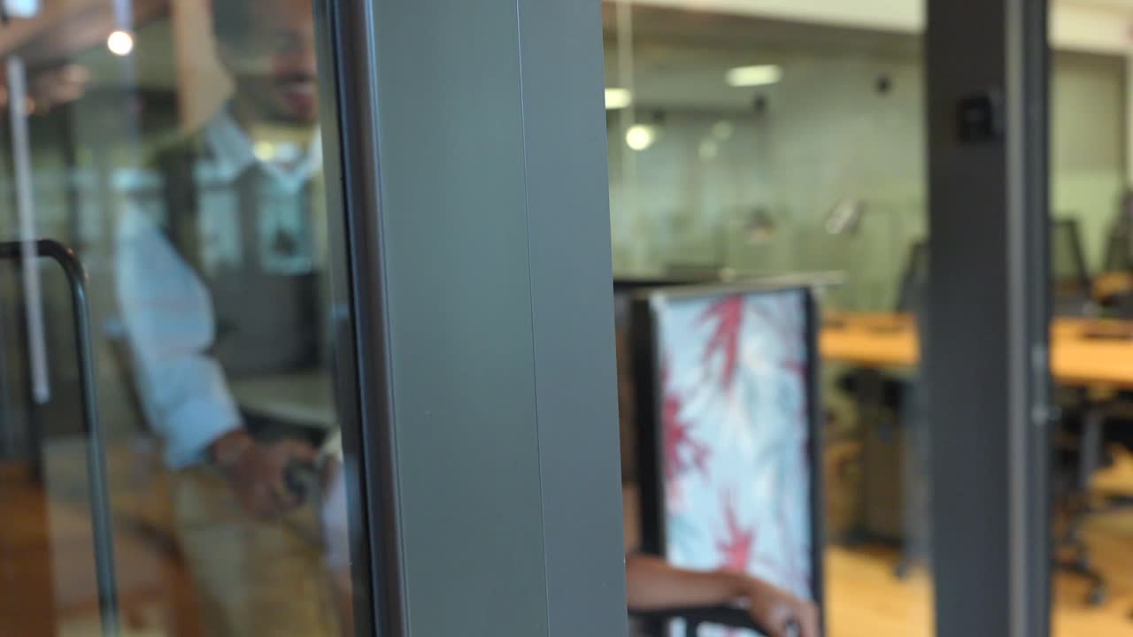 Inclusive Office Environment: Colleagues Supporting a Woman in a Wheelchair