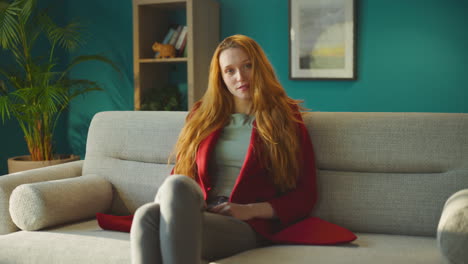 casual woman sitting on sofa