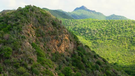 aerial telephoto reveal of christoffelberg mountain hills in curacao