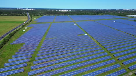 5g telecommunication tower in a huge solar panel plant in germany, capturing the convergence of technology and sustainability. amazing aerial view flight descending drone