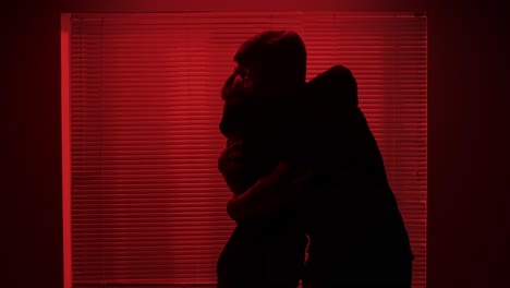 couple in silhouette at night