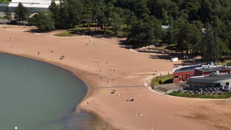 Telephoto aerial of people on the Hietaranta beach, sunny, summer day in Helsinki