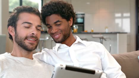 gay couple relaxing on the couch