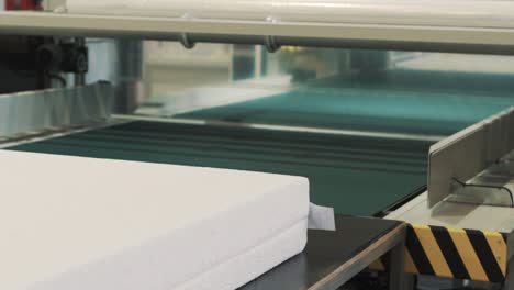 close-up of a mattress on the factory packaging line