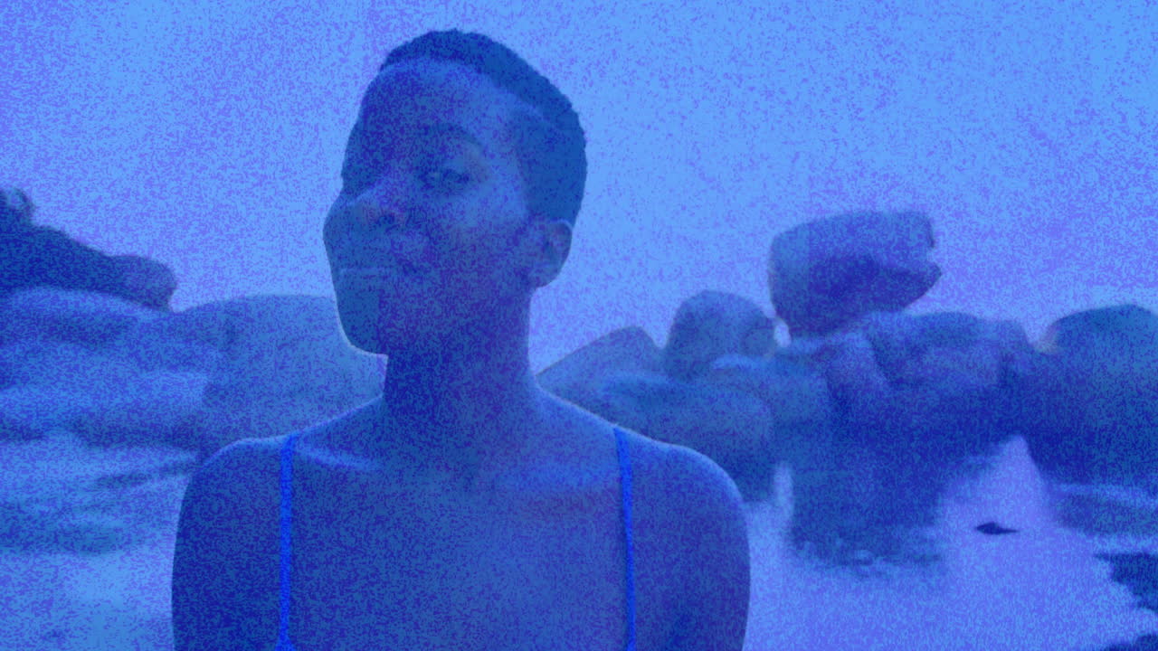 In animation, person smiling with blue overlay and abstract textured background