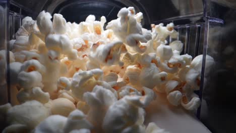 close up shot of tasty popcorns in motion lighting by professional studio light