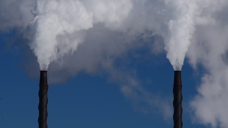 close-up-of-steam-billowing-out-of-two-exhaust-towers