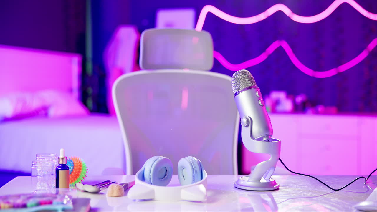 Modern desk setup with microphone and headphones for podcasting or streaming